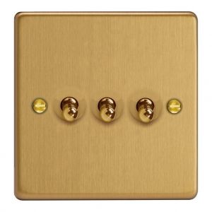 XDET3.BB Varilight 3 Gang 10 Amp Toggle Switch Essential Brushed Brass Finish With Black Toggle Switches