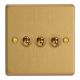 XDET3.BB Varilight 3 Gang 10 Amp Toggle Switch Essential Brushed Brass Finish With Black Toggle Switches